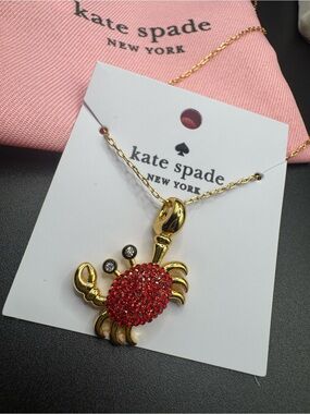 kate spade Gold Tone Crab Necklace with Red Crystal Shell